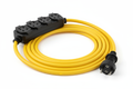 Outdoor-rated extension cord with three grounded outlets, designed for heavy-duty use in construction sites and home improvement projects.